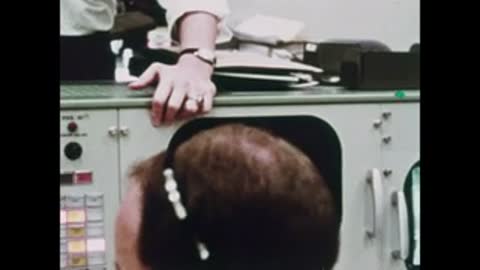 close-up of person looking at equipment control panel