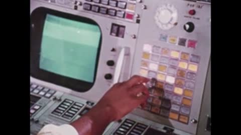 close-up of person pressing buttons on control console