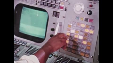 close-up of person pressing buttons on control console panel