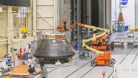 Orion spacecraft positioned on a specialized ground support platform for processing.