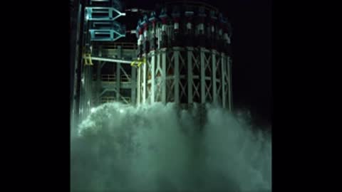 Closer static view of test structure rupture during pressure test with heavy spray.
