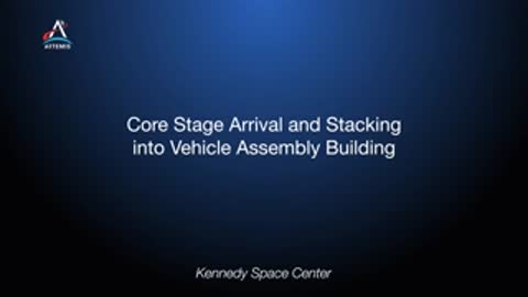 Title slide for Core Stage Arrival and Stacking into Vehicle Assembly Building at Kennedy Space Center.