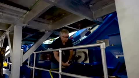 technician inspecting and working on internal components of large aerospace structure