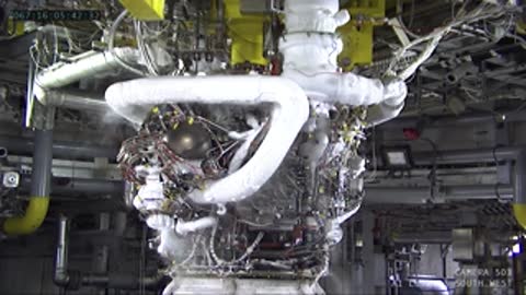 Close-up of rocket engine plumbing and components before ignition.