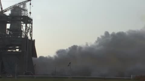 Medium view of smoke clearing around the test stand structure.