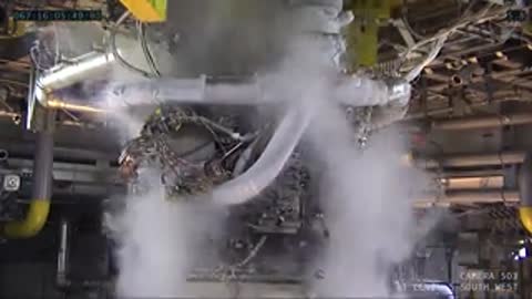 Close-up of rocket engine firing with smoke and exhaust.