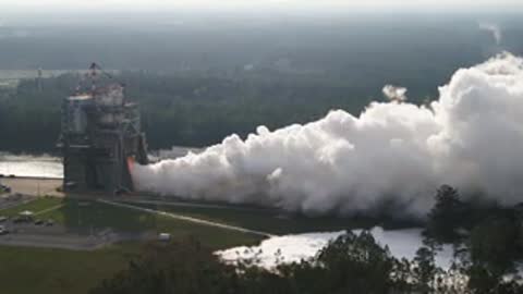 Wide view of the test stand with a massive plume of smoke.
