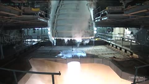 Medium shot of rocket engine firing during the test.