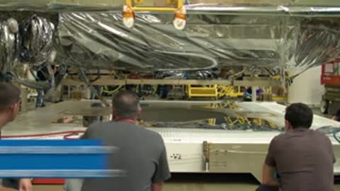 close-up of workers monitoring the telescope element movement inside the tent