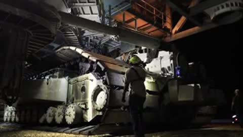 Crawler-transporter carrying mobile launcher at Kennedy Space Center at night