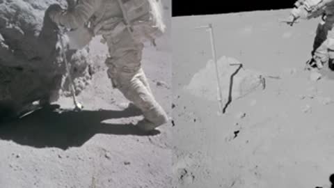 Archival footage of an astronaut's legs and shadow on the lunar surface.