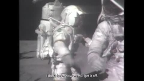 Historical black and white footage of astronauts on moon.