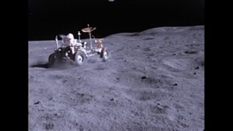 Lunar rover driving on the moon surface.