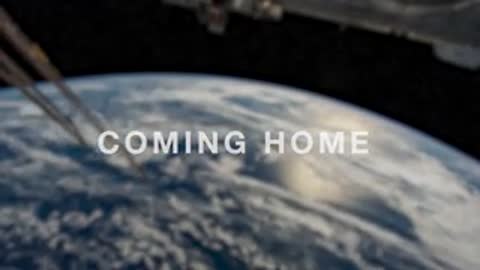 Earth viewed from space with "COMING HOME" text overlay.