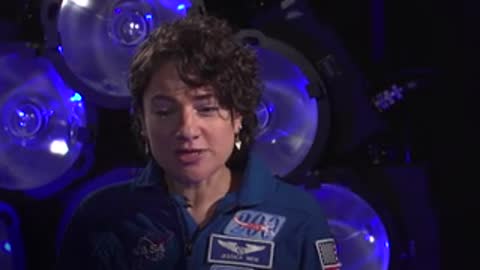 Speaker identified as Jessica Meir in blue uniform during interview.