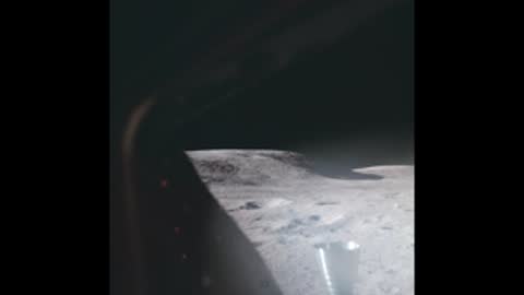 Archival view of the lunar surface seen through a spacecraft window