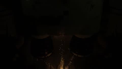 Rocket engines igniting in the dark before a launch