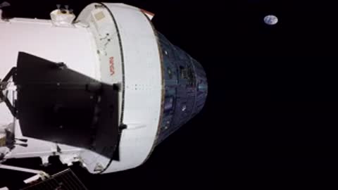 A spacecraft module travels in space with the Earth visible in the background.