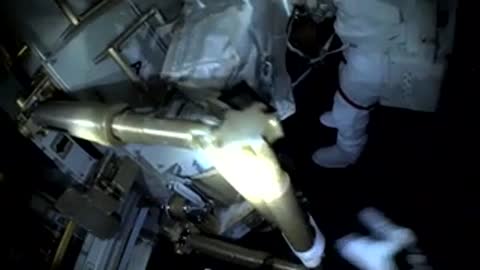 A robotic arm moves in space against the backdrop of the Earth.