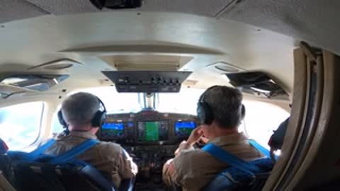 Interior view of pilots in the cockpit of the airplane.