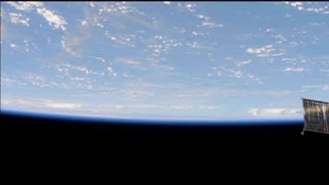 Panoramic view of the Earth's curvature and cloud cover from space.