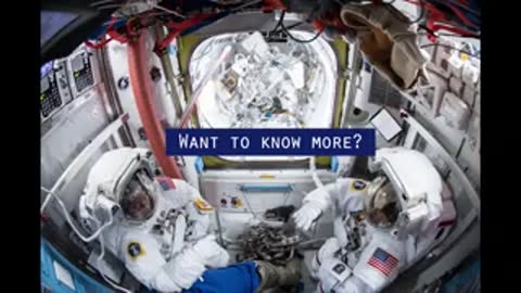 Astronauts sitting inside the International Space Station next to two ready spacesuits.