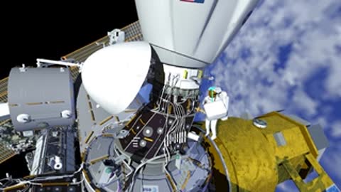 Astronaut moving along ISS structure