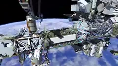 Wide animation showing astronauts working on various sections of the International Space Station structure.
