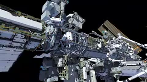 Animation tracking astronauts moving across the solar arrays and modules of the space station.