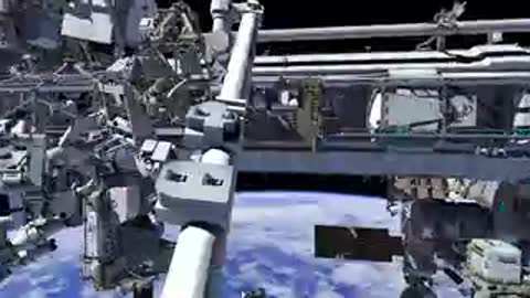 Animation panning past the robotic arm and structural components of the International Space Station.