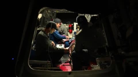 Wide exterior view of vehicle simulator with crew inside.