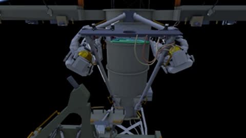Close-up of wiring and connections being managed by an astronaut during a spacewalk.