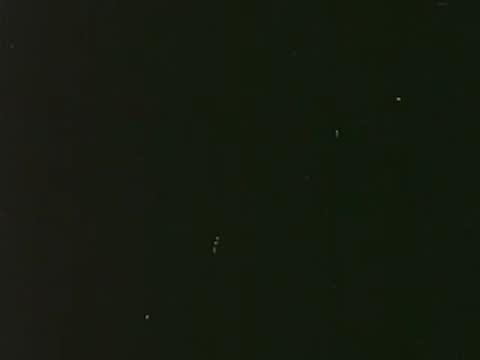 A dark, mostly black screen with very faint text.