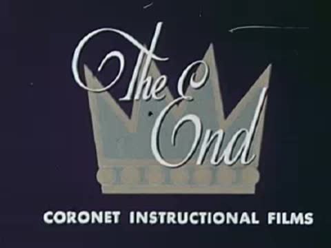 Intertitle graphic reading "The End" inside a crown with Coronet Instructional Films text.