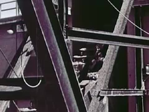 Close-up view of steel framework and cables at an industrial site