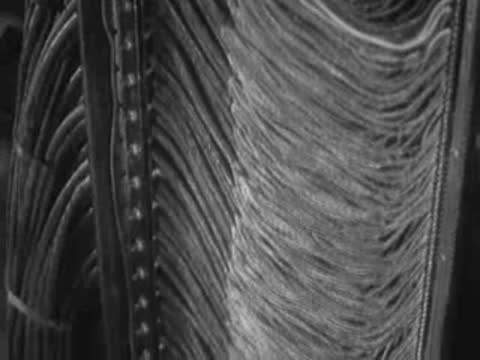 Dense bundles of electrical cables connecting electronic components in equipment.