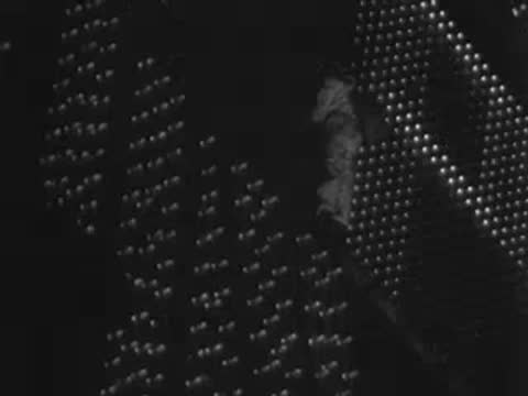 Close-up of illuminated sign lights and geometric patterns being switched off.