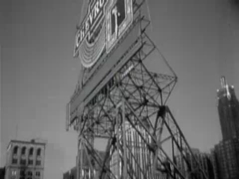 Large Chevrolet billboard sign mounted on top of a steel structure.