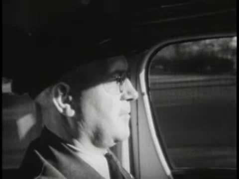 Bus driver profile, wearing cap and glasses, vintage uniform.