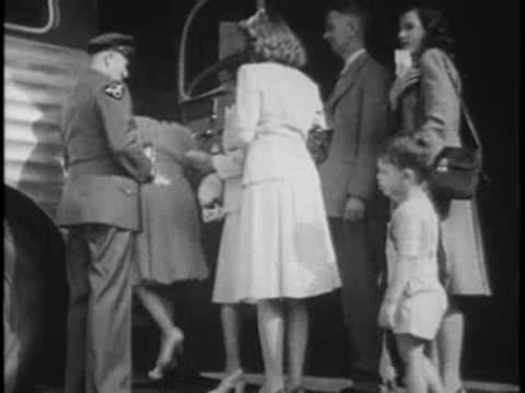 Passengers boarding a bus outside while the driver checks tickets at the door