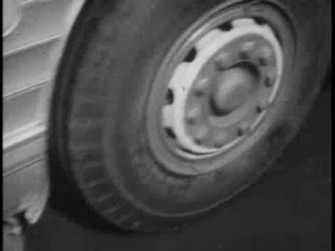 Close-up of bus wheels starting to move and rolling away on the pavement