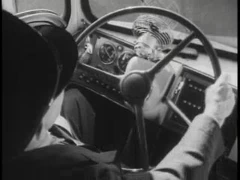 Driver's perspective operating bus steering wheel and controls.