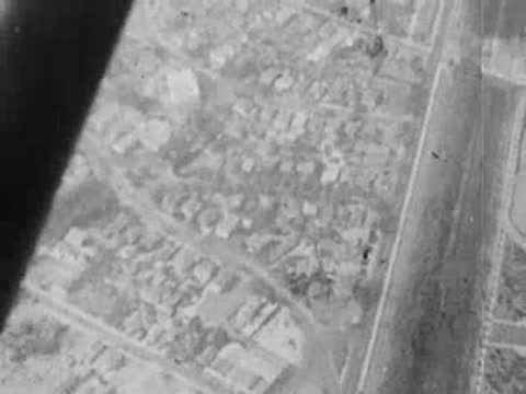 An aerial view of a road and residential neighborhoods.