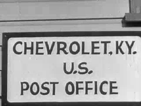 Sign reading "CHEVROLET, KY. U.S. POST OFFICE" transitioning to a dark shot