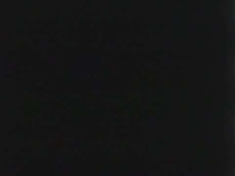 Title card fades to show a small fleet of sailboats on dark water.
