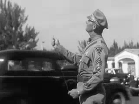 Police officer in uniform directing traffic on a city street