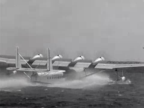 Pan American seaplane takes off from the water.