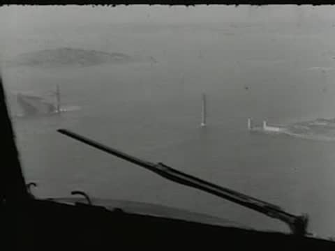 View from inside an aircraft cockpit looking out over water.