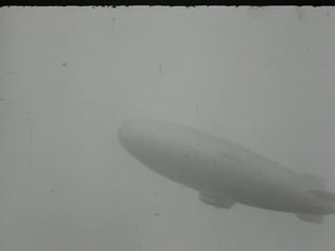 blimp flying in the sky