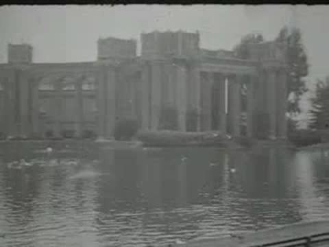 building with an archway near a body of water